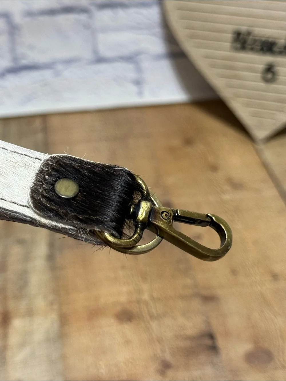 keychain hair-on-hide cowhide strap paired with a brass hook